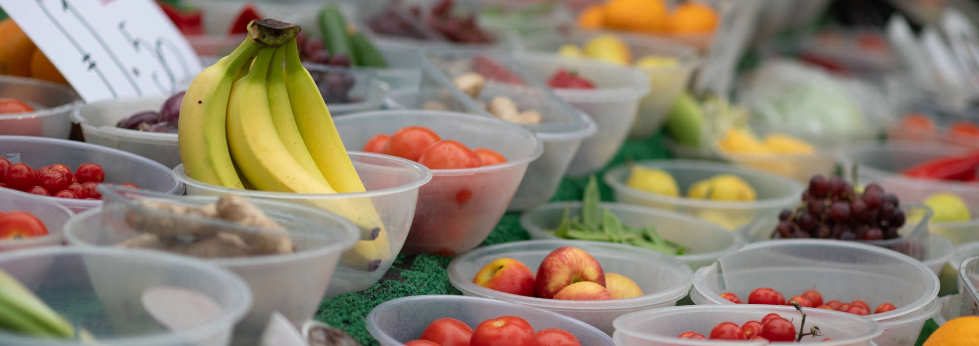 Fresh bananas and assorted fruits at a local market stall in Kidlington.