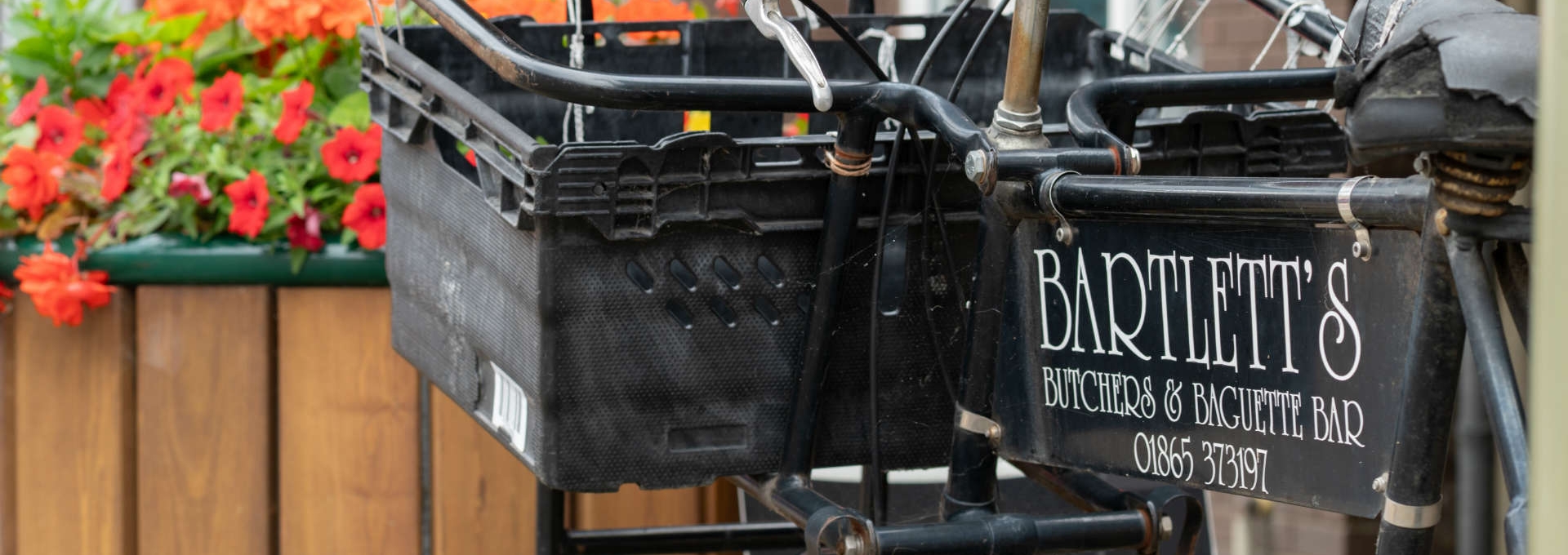 Bike with basket outside Kidlington Parish Council building, Oxfordshire, UK.